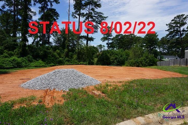 117 Constance Court Perry, GA 31069 - Photo 2 of 8 a street sign that is sitting on a road