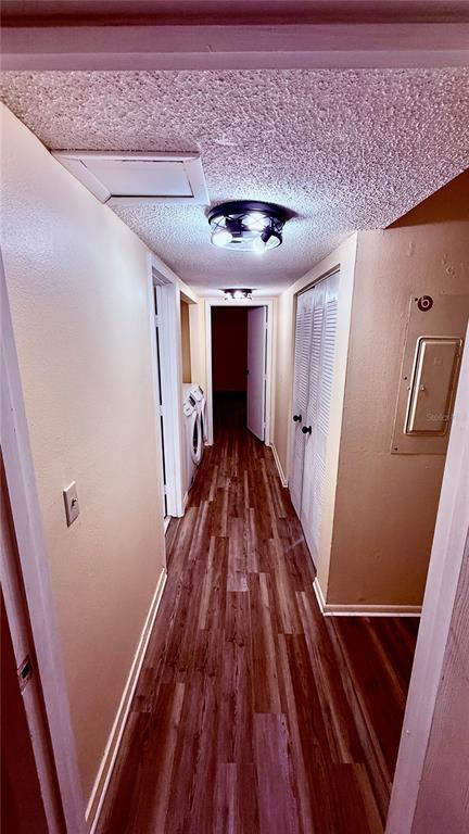 6519 West Newberry Road, Unit 206 Gainesville, FL 32605 - Photo 12 of 14 a view of a hallway with wooden floor