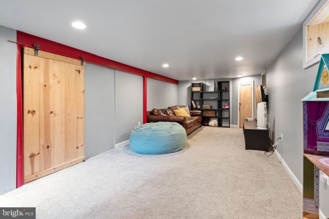 a big room with closet and a large window