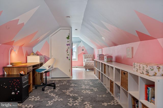 a view of a room with furniture and window