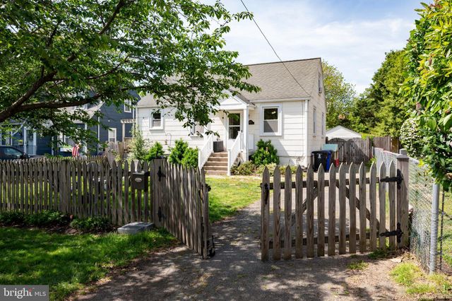 a view of a house with a yard and balcony