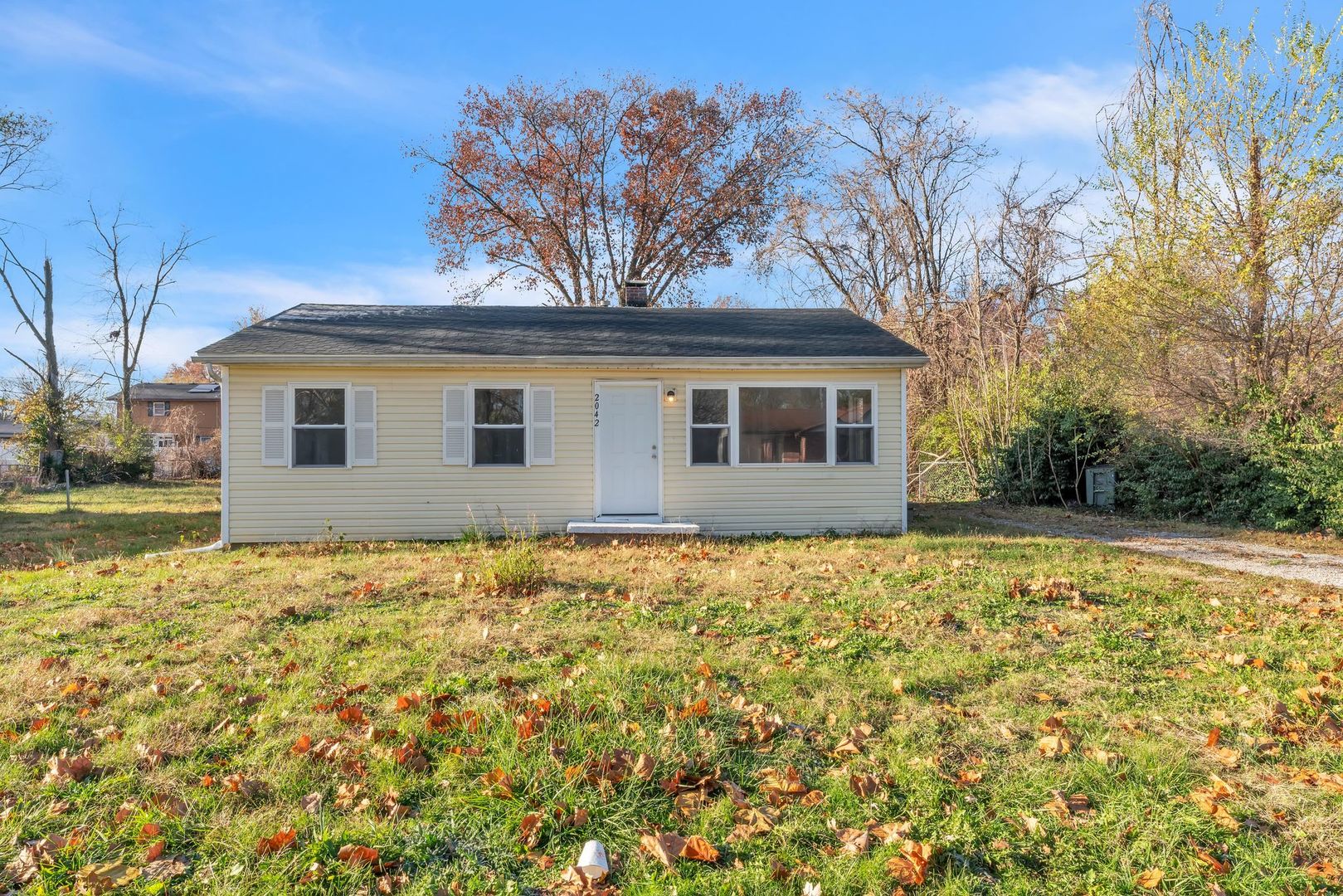 front view of a house with a yard