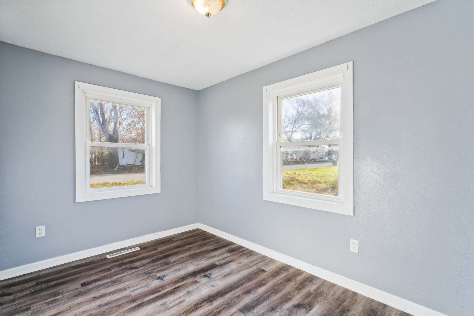 2042 Sandy Ridge Road Cahokia, IL 62206 - Photo 11 of 21 a view of an empty room with wooden floor and a window