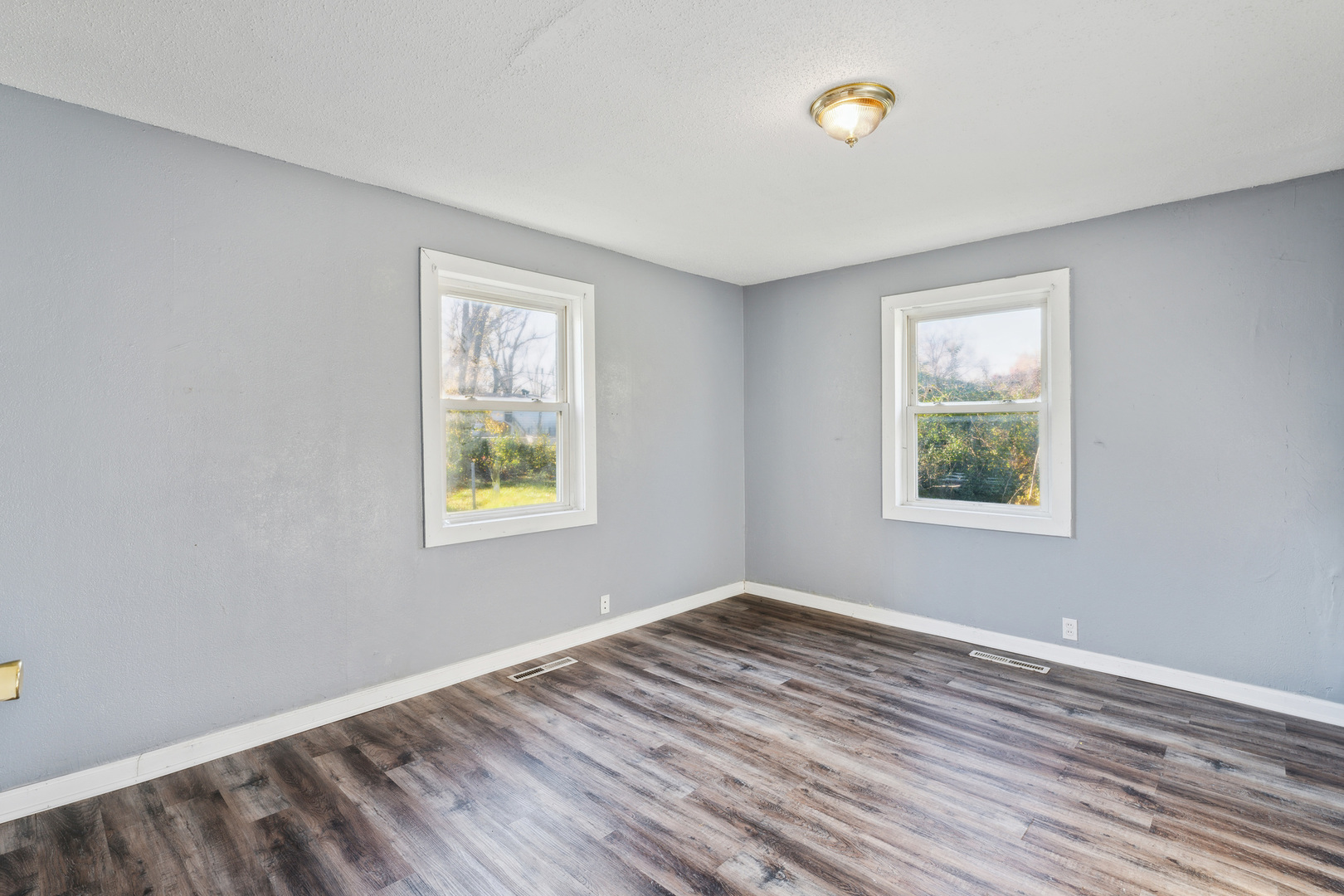 2042 Sandy Ridge Road Cahokia, IL 62206 - Photo 12 of 21 a view of an empty room with wooden floor and a window