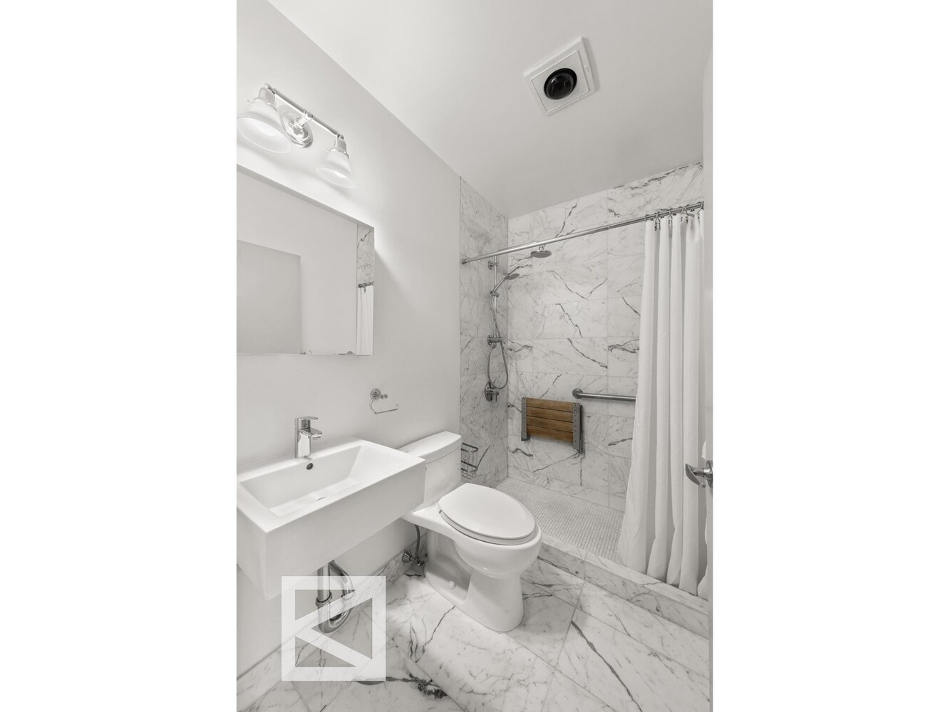 1001 5th Avenue, Unit 110C Manhattan, NY 10028 - Photo 10 of 14 a bathroom with a toilet a sink and a shower