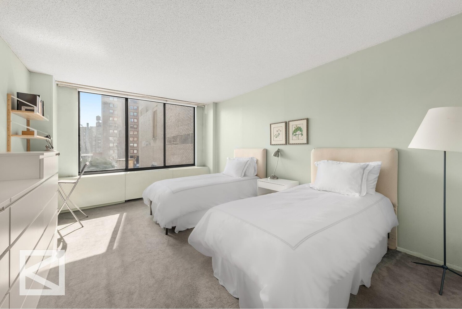 1001 5th Avenue, Unit 110C Manhattan, NY 10028 - Photo 11 of 14 a bedroom with two beds and a large window