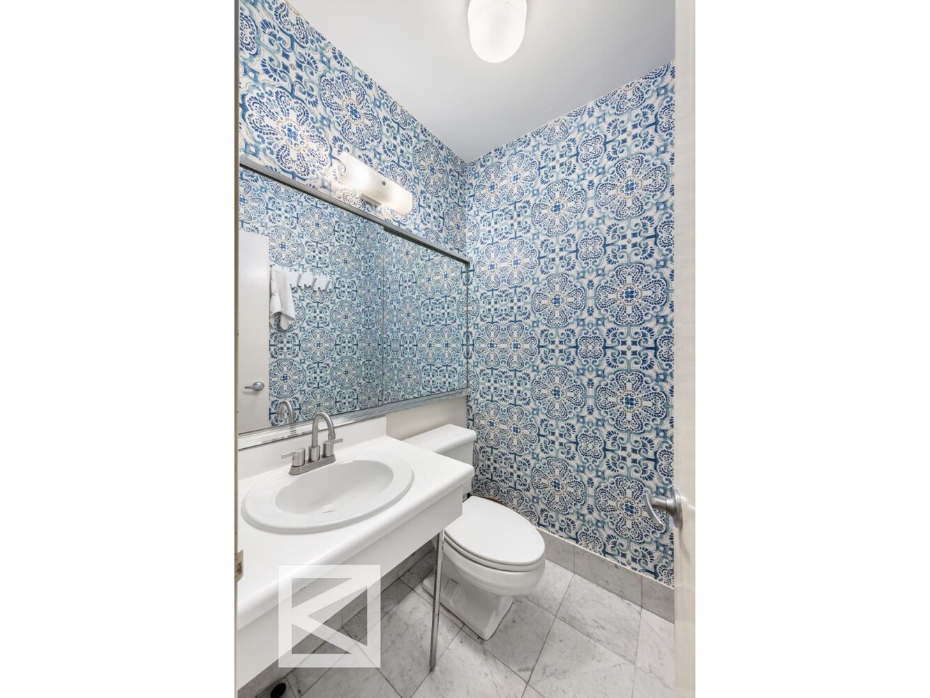 1001 5th Avenue, Unit 110C Manhattan, NY 10028 - Photo 13 of 14 a bathroom with a toilet and a sink