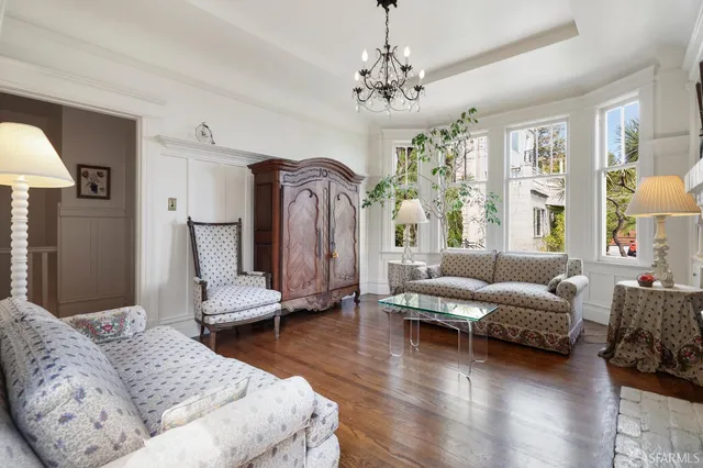 a bedroom with a bed couch and a window