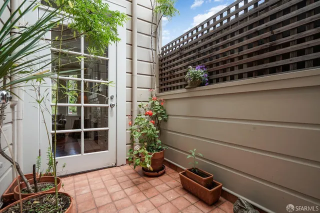 a vase of flowers sitting on a floor