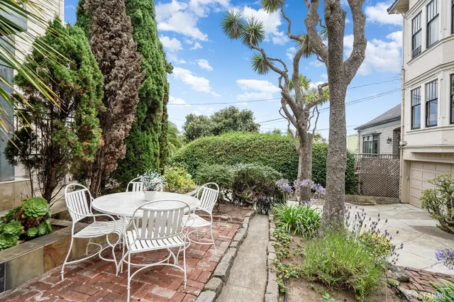 a view of outdoor dining space with a patio and plants