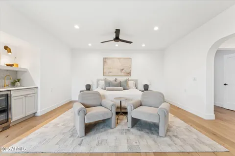 a large bathroom with a double vanity sink a mirror and a bathtub