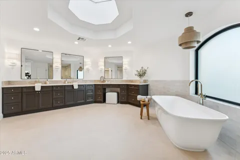 a view of empty room with wooden floor and ceiling fan