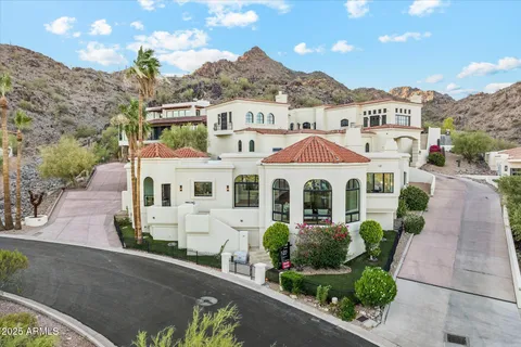 a kitchen with stainless steel appliances kitchen island granite countertop a large stove a sink dishwasher and a refrigerator with wooden floor