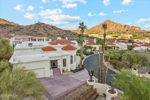 a kitchen with stainless steel appliances granite countertop a sink a stove and a wooden floors