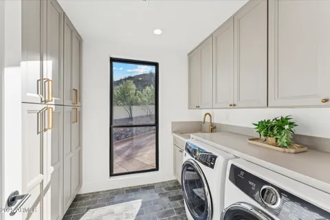 a living room with a couch and a floor to ceiling window