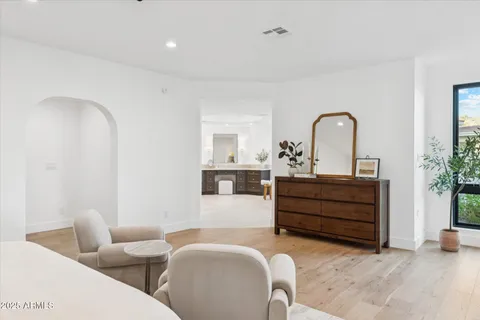 a view of living room with furniture and a large window