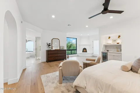 a bedroom with two beds and a dresser