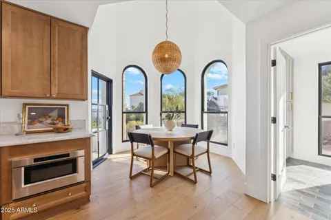 a view of a dining room with furniture window and wooden floor