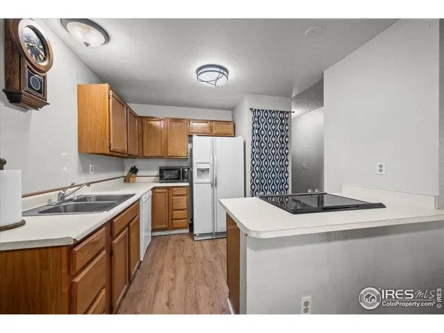 a kitchen that has a sink and a stove in it