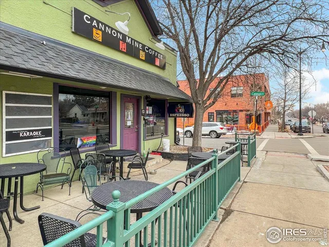 a view of a cafe with sitting area