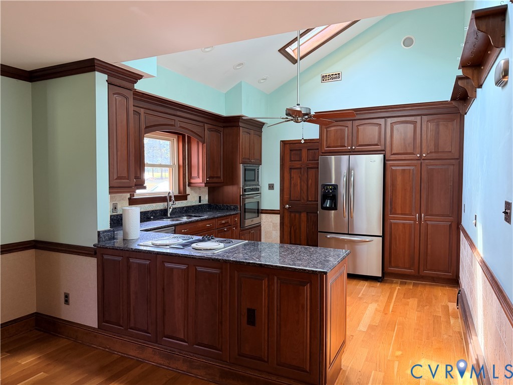 5970 Springfield Road Glen Allen, VA 23060 - Photo 3 of 17 a kitchen with stainless steel appliances granite countertop a refrigerator and a sink