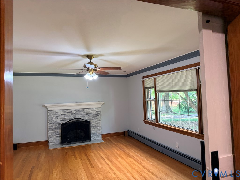 5970 Springfield Road Glen Allen, VA 23060 - Photo 8 of 17 a view of a livingroom with a fireplace and window
