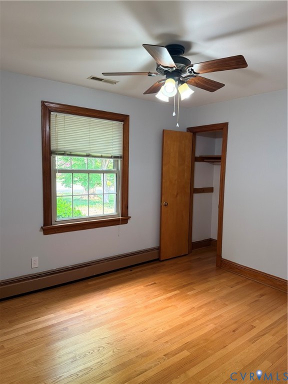 5970 Springfield Road Glen Allen, VA 23060 - Photo 9 of 17 a view of an empty room with wooden floor and a window