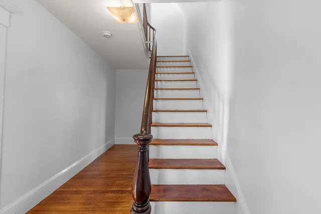 a view of entryway with wooden floor