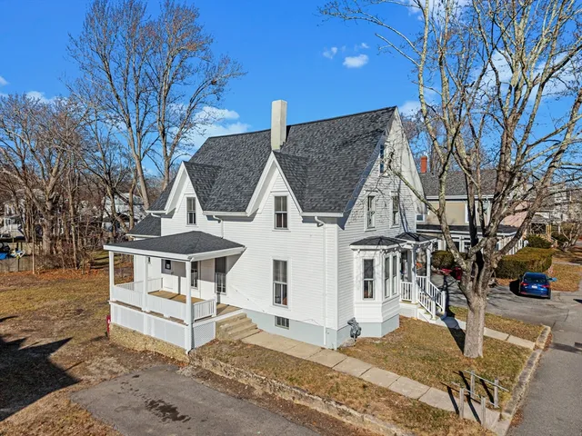 a view of a house with backyard and chair