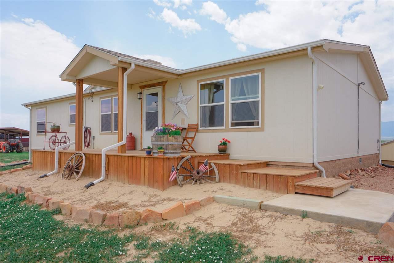 3101 County Road 110 Rye, CO 81069 - Photo 2 of 29 a front view of house with outdoor seating