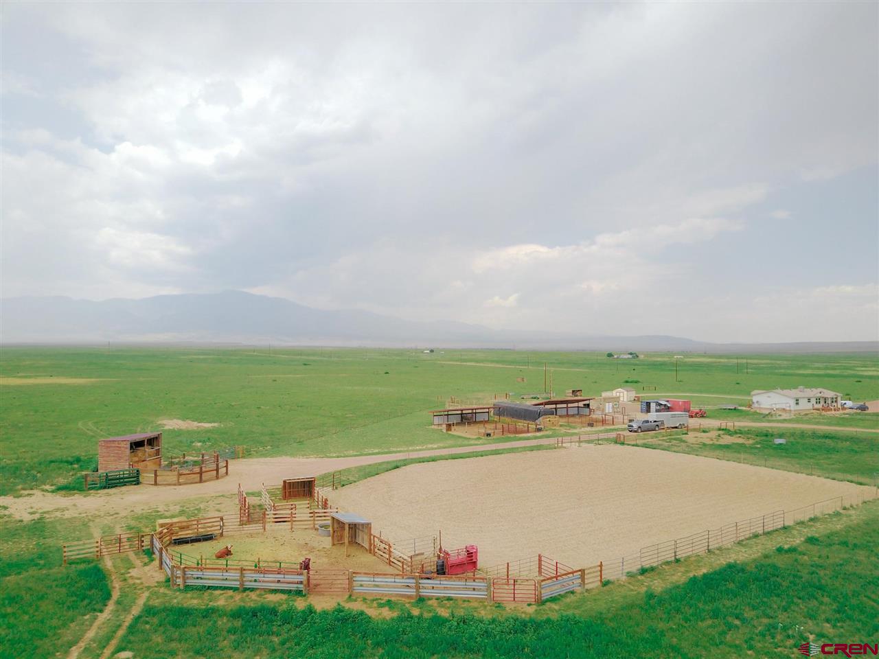 3101 County Road 110 Rye, CO 81069 - Photo 13 of 29 an aerial view of a city with lots of residential buildings and ocean view in back