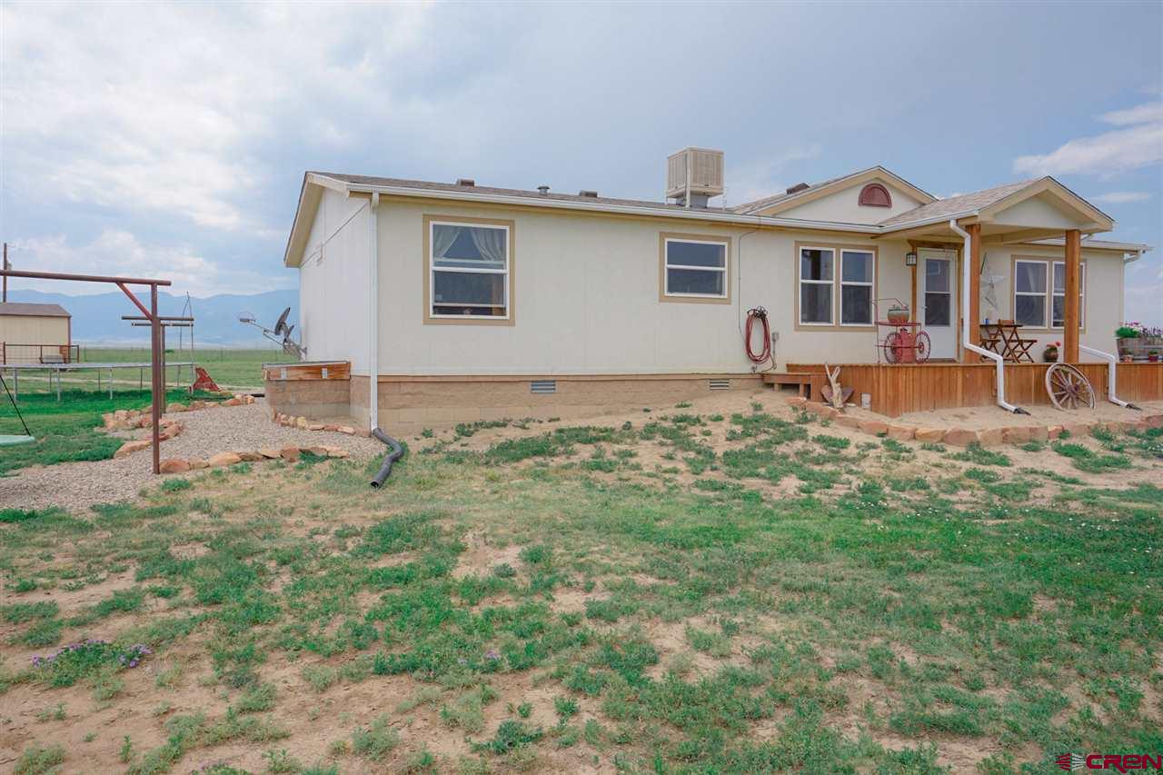 3101 County Road 110 Rye, CO 81069 - Photo 3 of 29 a front view of house with yard and outdoor seating