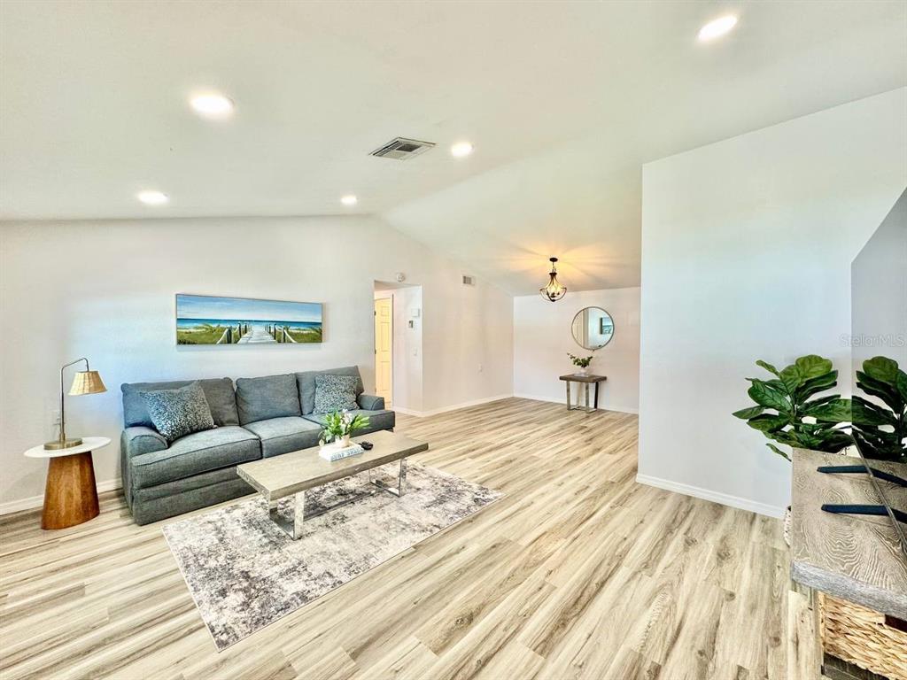 4282 Rudder Way New Port Richey, FL 34652 - Photo 6 of 34 a living room with furniture and a chandelier