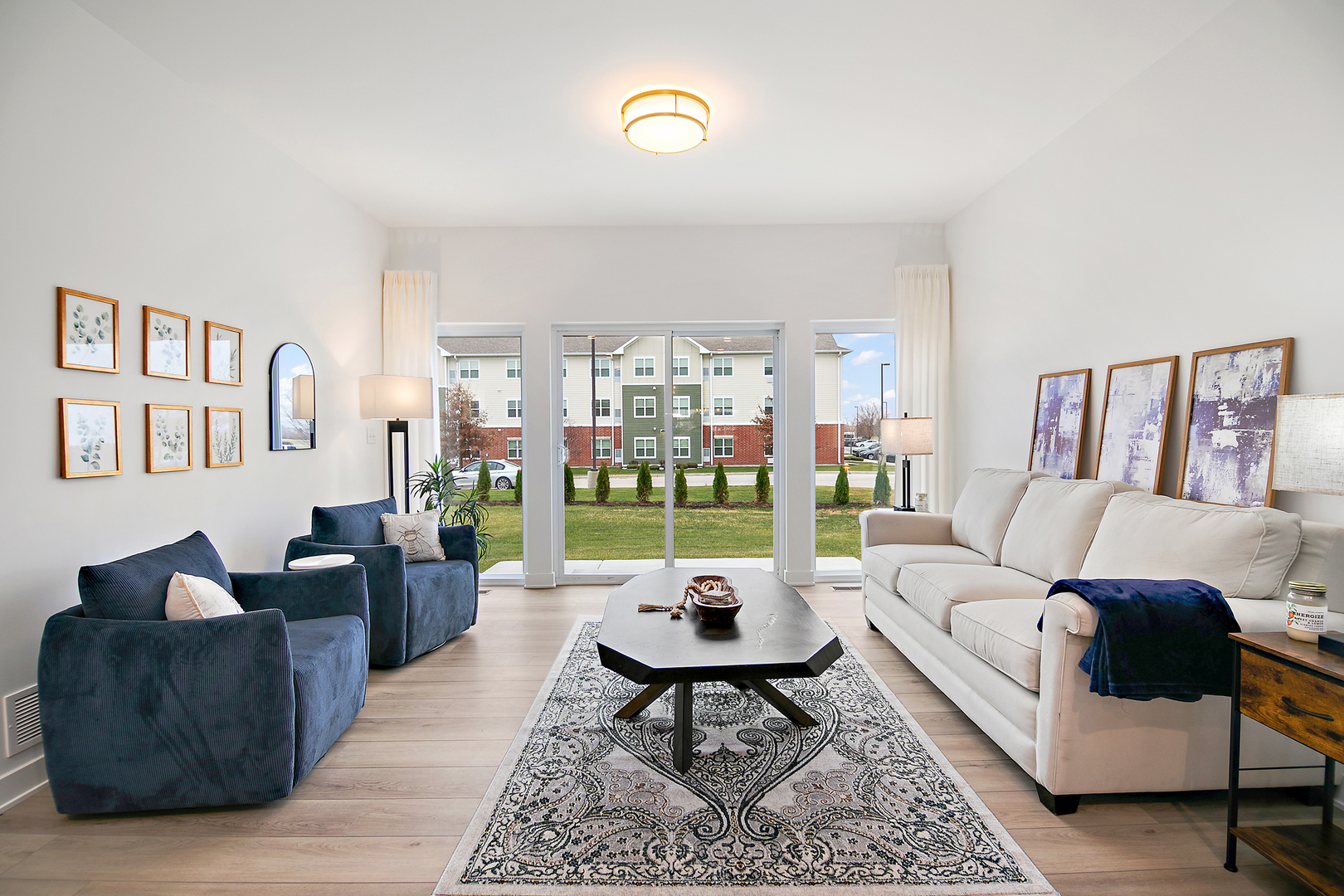 2050 Isabella Lane Minooka, IL 60447 - Photo 17 of 32 a living room with furniture and a floor to ceiling window