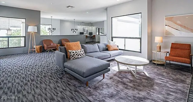 a living room with furniture and a window