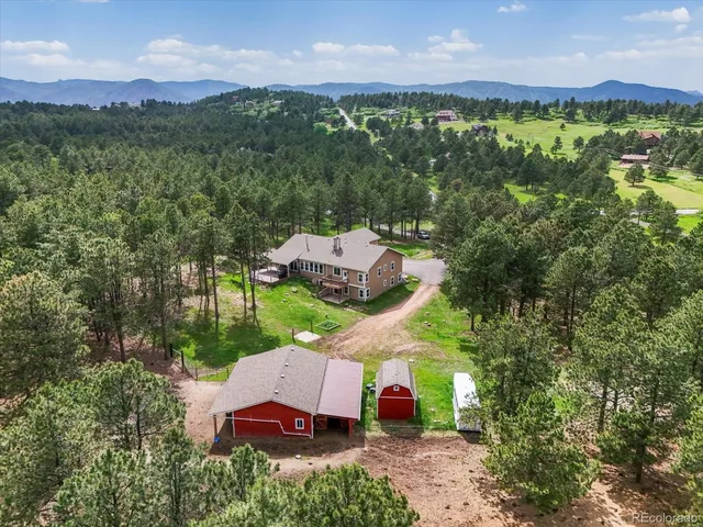 a aerial view of a house with a yard