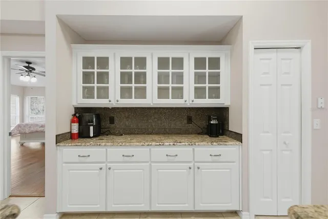 a kitchen with a cabinets and window