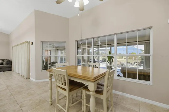 a dining room with furniture and window