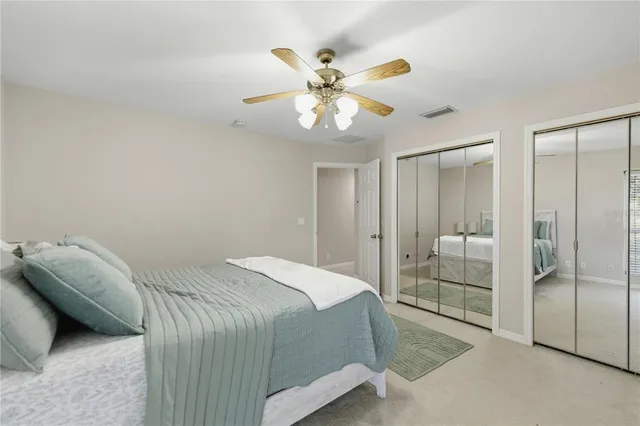 a bathroom with a double vanity sink toilet and shower