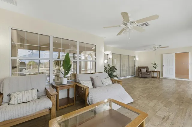 a view of a swimming pool with outdoor seating