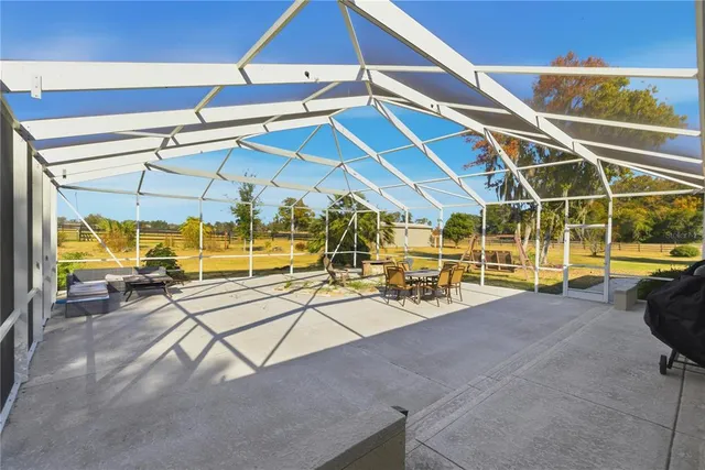 a view of a swimming pool with a patio