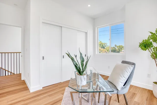 a view of kitchen with furniture and a potted plant