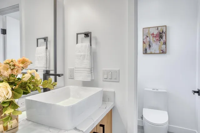 a bathroom with a sink a toilet and a bathtub
