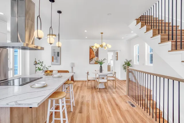 a very nice looking room with a large window and furniture