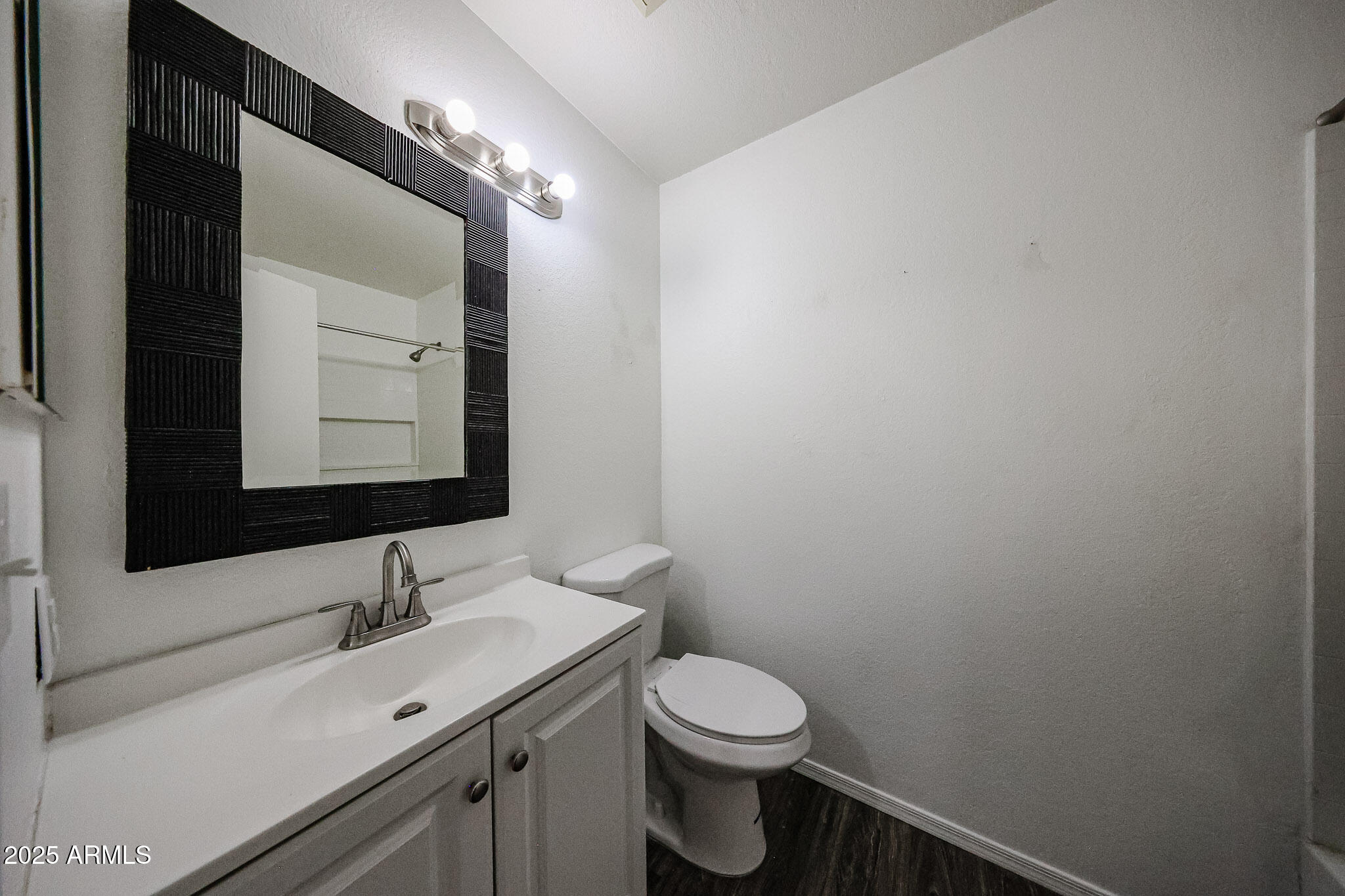 7977 West Wacker Road, Unit 245 Peoria, AZ 85381 - Photo 11 of 42 a bathroom with a sink and a mirror