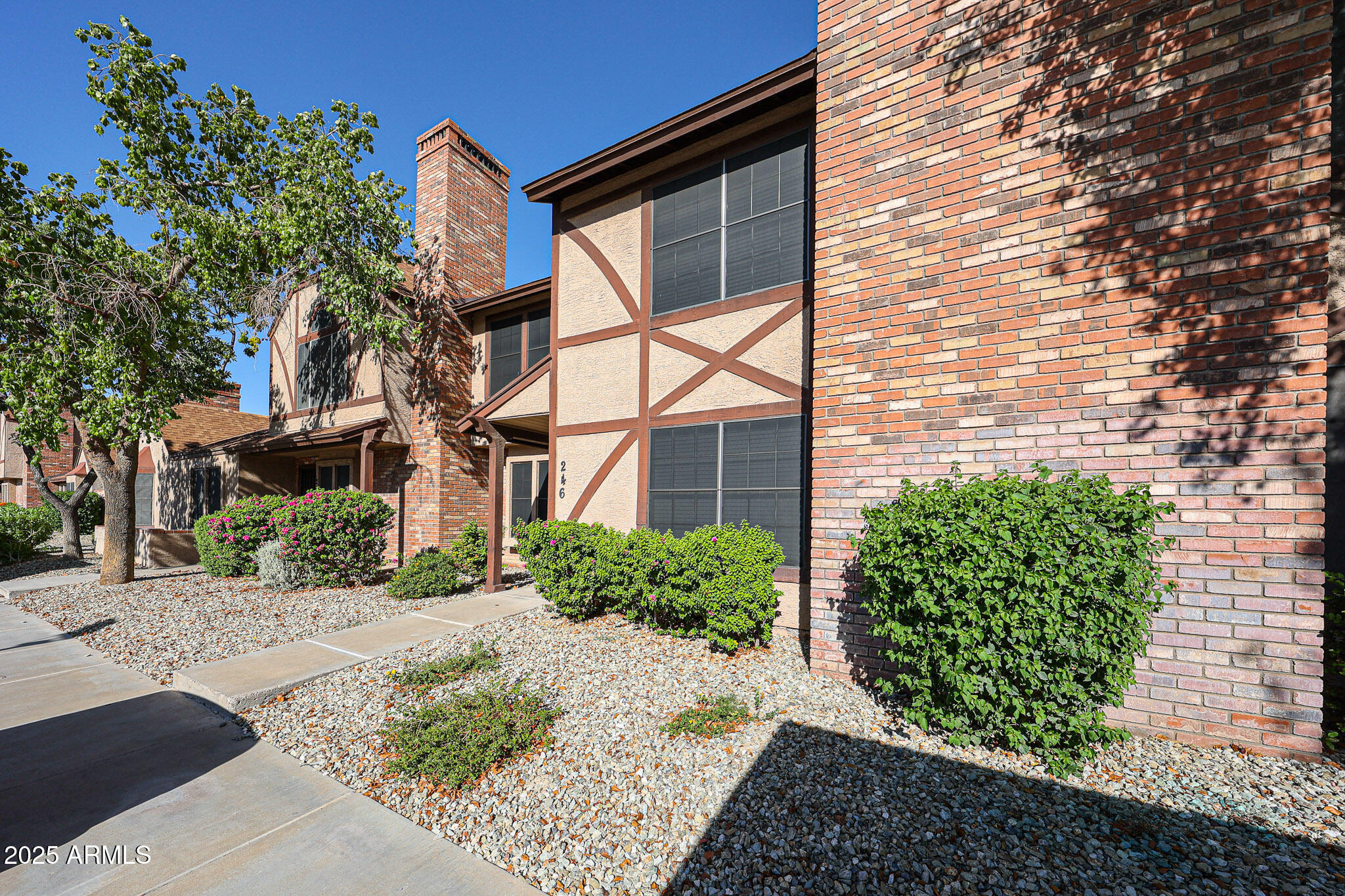 7977 West Wacker Road, Unit 245 Peoria, AZ 85381 - Photo 5 of 42 a view of a building with a yard