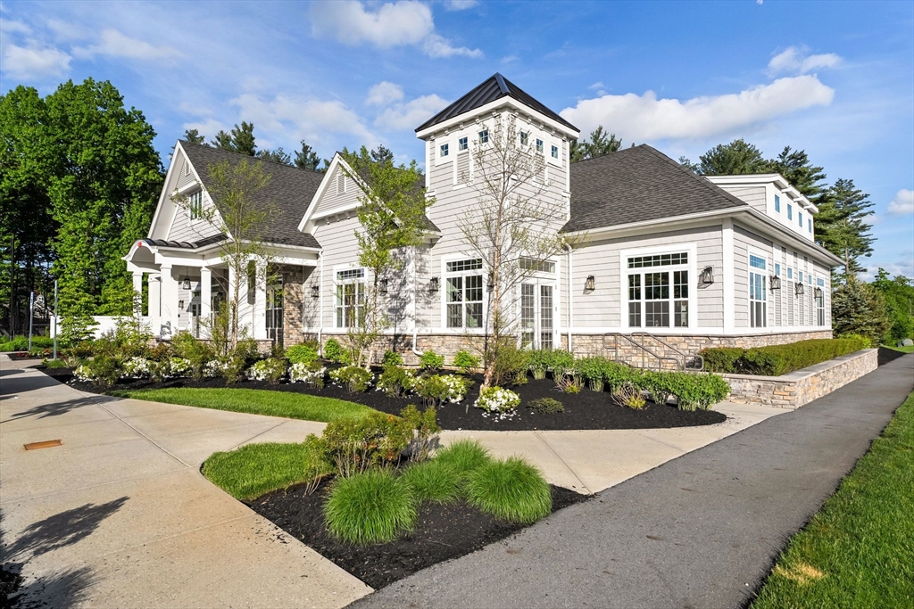 2 Hummingbird Way, Unit 1 Methuen, MA 01844 - Photo 42 of 42 front view of a house with a yard