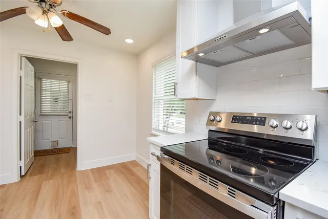 a kitchen with a stove and a refrigerator