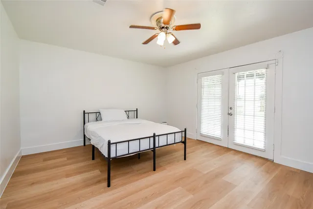 a room with a bed and a chandelier