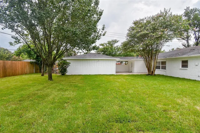 a view of a backyard with a garden